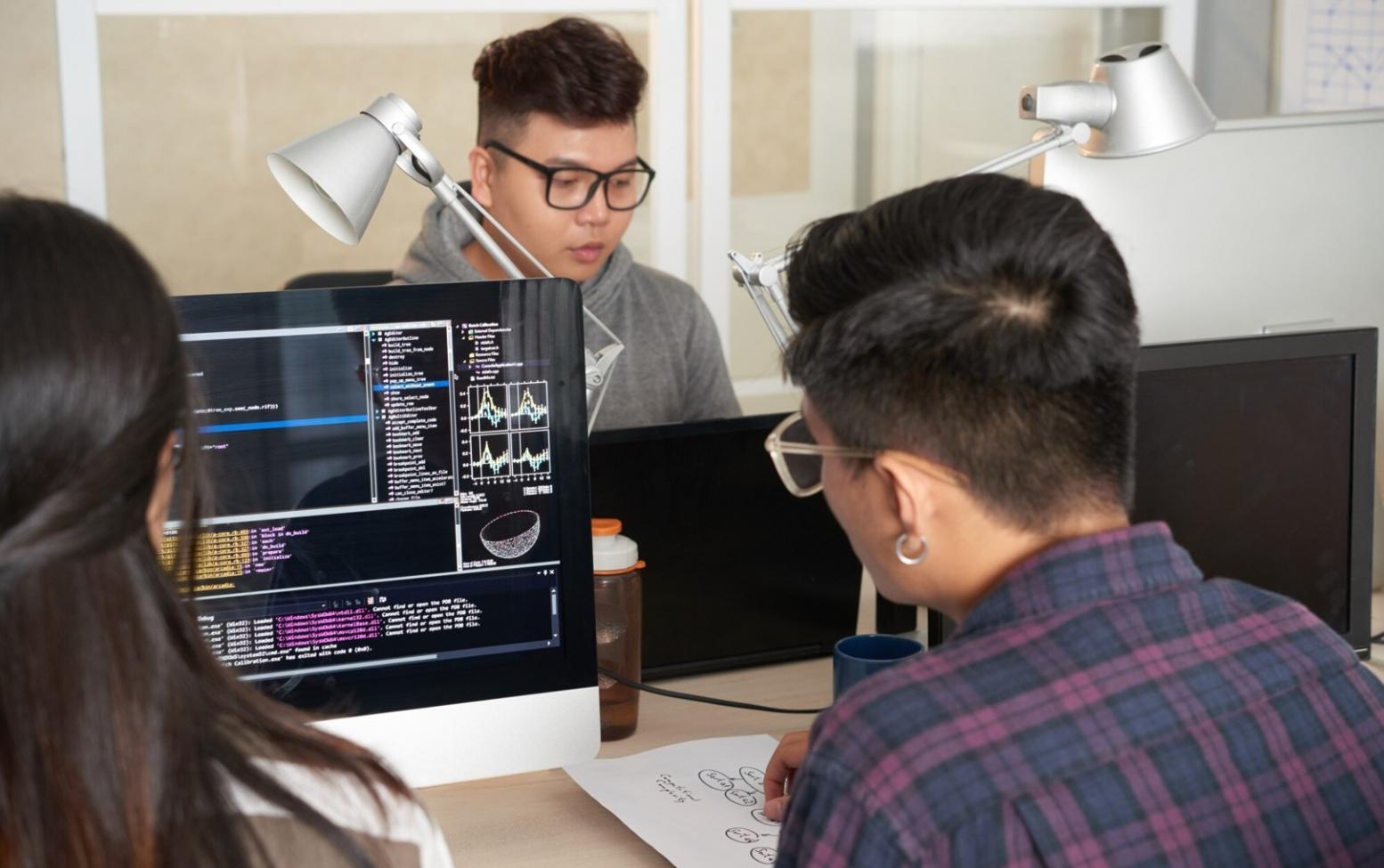 Designer reviewing interface work at their desk